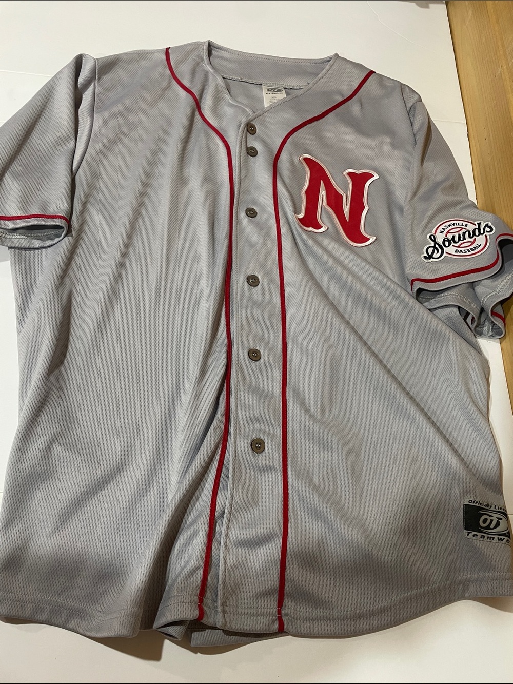 Nashville Sounds Gray Baseball Jersey with Red Trim and 'N' Patch